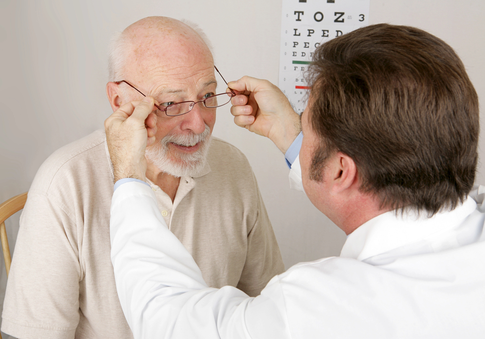 Senior man being fitted for reading glasses to correct presbyopia