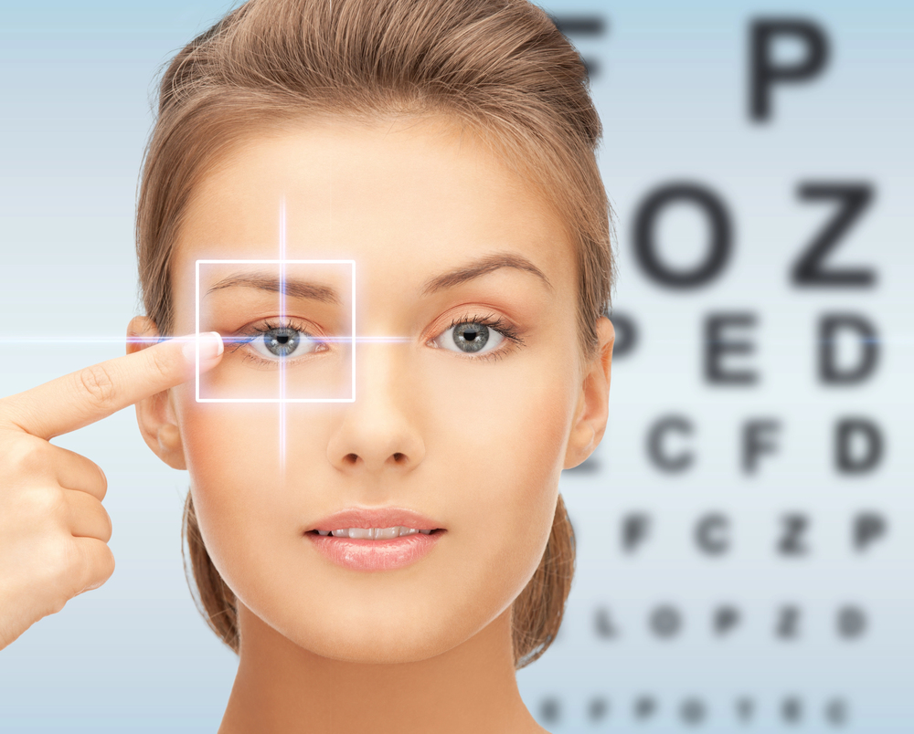 Woman pointing at eye during vision test at Tulsa eye doctor